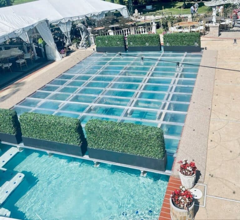 Inground Pool Covers creating a clear event-ready platform over a backyard swimming pool