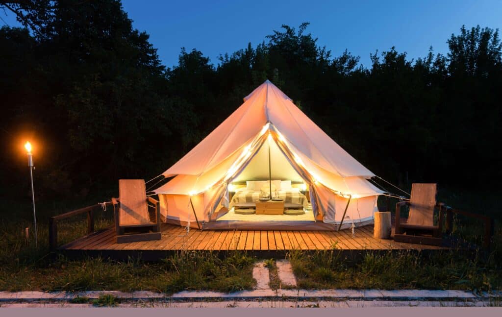 Setting up a backpacking tent in a beautiful wilderness under a dark sky is perfect for camping trips.